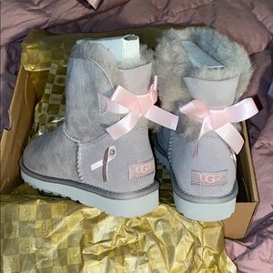 Gray Uggs with pink breast cancer ribbons